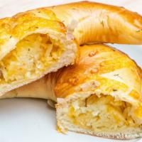 Potato, Cheese  Piroshky · Our potato and cheese piroshky, with shredded potatoes, light onions for flavor and cheddar ...