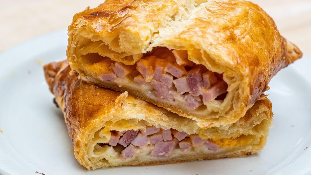 Ham And Cheese Piroshky · Freshly baked Ham and cheddar cheese wrapped in our flaked dough!