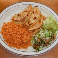 Tacos Ala Plancha · Three crisp chicken special tacos on a corn tortilla with melted cheese. Served with rice. G...