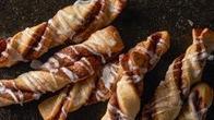 6 Cinnamon Twists · Our famous twists, rolled in a brown and white sugar cinnamon mixture and topped with a deli...