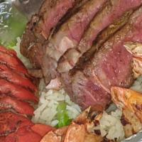 Surf And Turf Platter · Seasoned ribeye, grilled shrimp, and oven cooked buttered lobster.