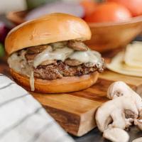 Swiss & Mushroom · Third Pound USDA Choice burger covered with sauteed mushrooms & melted swiss cheese.  Served...