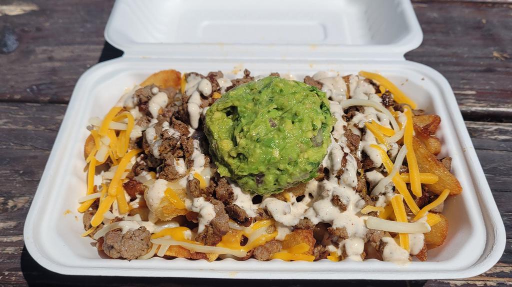 Carne Asada Fries  · Hand cut fries smothered in cheddar jack cheese and topped with asada marinated steak, asada ranch,  and guacamole.