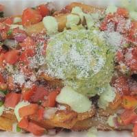Mexicali Fries · Our delicious hand-cut fries topped with guacamole, pico de gallo, avocado crema, and cotija...