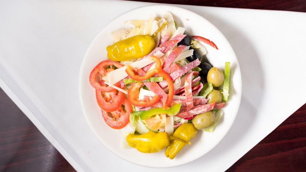 Antipasto Salad · Artichoke hearts, fresh roma tomatoes, pepperoncinis, black and green olives, provolone cheese, genoa salami, red and green bell pepper, radishes and cappicola.