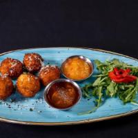 Goat Cheese Bites · with truffle honey and pepper jellysauce
