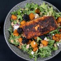 Blackened Salmon Salad · blackened salmon, arugula and spring mix with goat cheese, dried cranberries, spiced almonds...