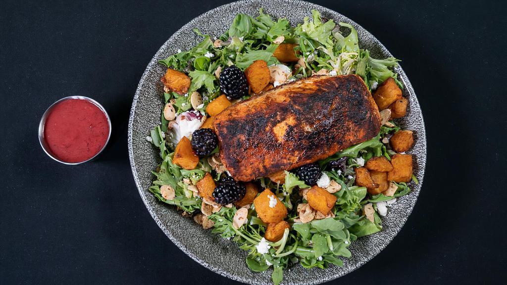 Blackened Salmon Salad · blackened salmon, arugula and spring mix with goat cheese, dried cranberries, spiced almonds and a blackberry vinaigrette