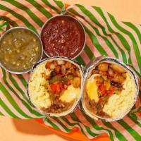 Fluffy Fajita Breakfast Burrito · Two scrambled eggs with crispy hash browns, melted cheese, sauteed peppers and onions, and s...