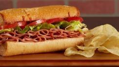 Cliff Hanger · A hearty oven-baked deli sandwich! We load a fresh roll with your choice of salami, ham, or ...