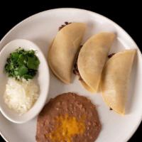 3 Street Tacos · Steak, grilled chicken, pork carnitas or chorizo; garnished with onion and cilantro, served ...