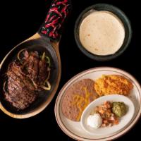 Two Meat Fajitas · Choose from steak, grilled chicken, fish or shrimp, served sizzling with bell pepper and oni...