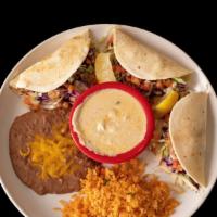 3 Fish Tacos · Flour tortillas with grilled fish garnished with cabbage, pico de gallo and creamy house sau...