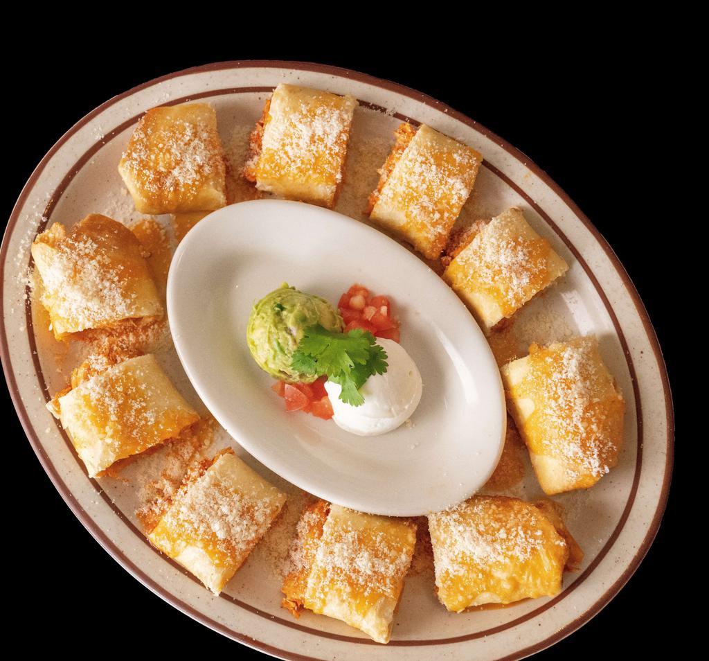 Chicken Taquitos · Rolled crispy flour tortilla stuffed with shredded chicken and cheese, topped with sour cream and guacamole.