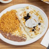 Enchiladas Supreme · Two enchiladas filled with spicy chicken, covered with a creamy sauce then topped with chees...