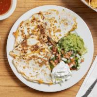 Quesadilla Cocina · Grilled flour tortilla with cheese, topped with pico de gallo, guacamole, sour cream.