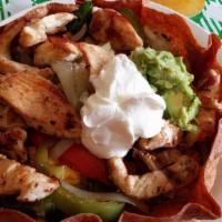 Fajita Salad · Marinated chicken breast or steak sauteed, served on a bed of lettuce with cheese, fresh tom...