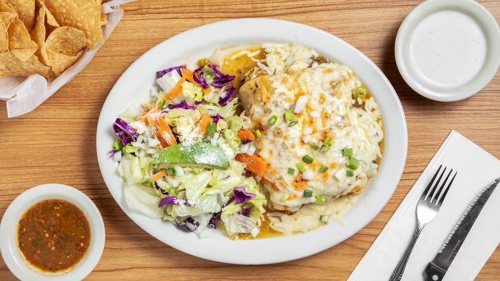 Enchiladas Suizas · Wo cheese enchiladas with tomatillo sauce, topped with onions, green chile strips, and sour cream. Served with beans and rice.