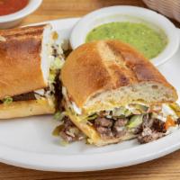 Torta · Toasted Mexican sandwich with mayo, sour cream, tomato, avocado, lettuce, onion, jalapeño an...
