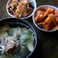 Galbitang · Beef short ribs, daikon, clear noodles, egg & green onions, comes with rice & side kimchi.