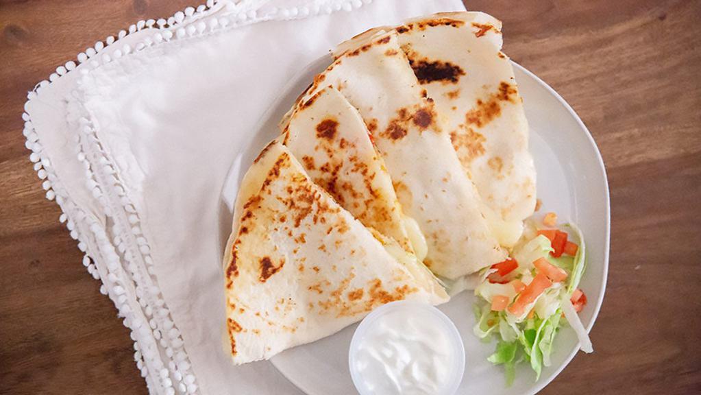 Quesadilla · Flour tortilla filled with your choice of meat.