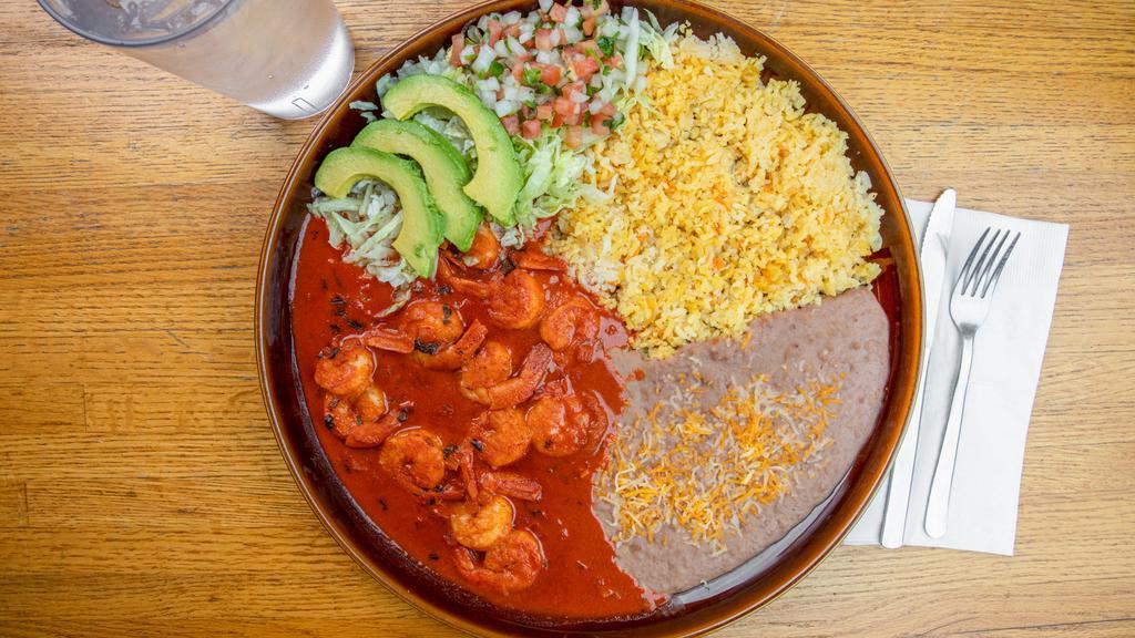 Camarones A La Diabla · Sautée shrimp smothered in our homestyle deviled sauce. Served with a side of rice, beans, lettuce, tomato, and avocado slices. With your choice of corn or flour tortilla.