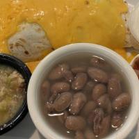Breakfast Burrito  · Hash browns, 2 Eggs, Onions, Green Peppers, Cheddar Cheese, Refried Beans, Chile Verde and y...