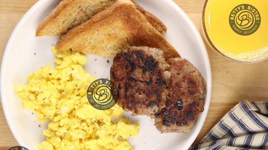 The Classic · Three scrambled eggs served with choice of bacon or sausage. Served with toast and Betty's Baked potatoes.