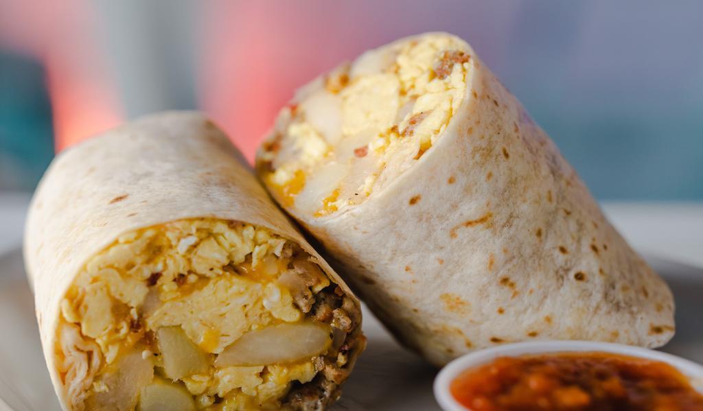The Breakfast Burrito · 3 scrambled eggs, cheddar cheese, baked potatoes, sausage and bacon with a side of pico de gallo.