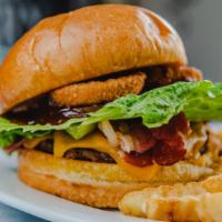 Bbq Burger 	 · Angus beef, Pepper Jack cheese, onion rings, banana peppers, BBQ sauce on a Brioche bun