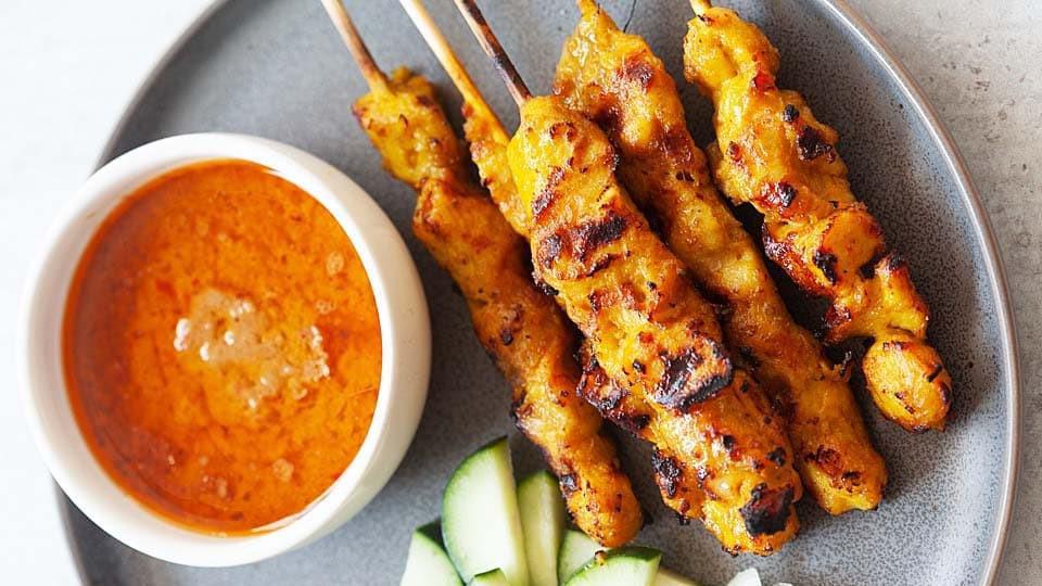 Thai Chicken Satay (Skewer) · Three pieces. Grilled chicken skewers marinated with Thai herbs and coconut milk. Served with peanut sauce.