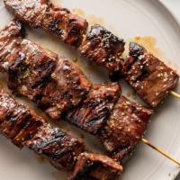 Flank Steak Skewer (3 Pcs) · Marinated beef with steak seasoning and grill - medium rare. Served with peanut sauce.