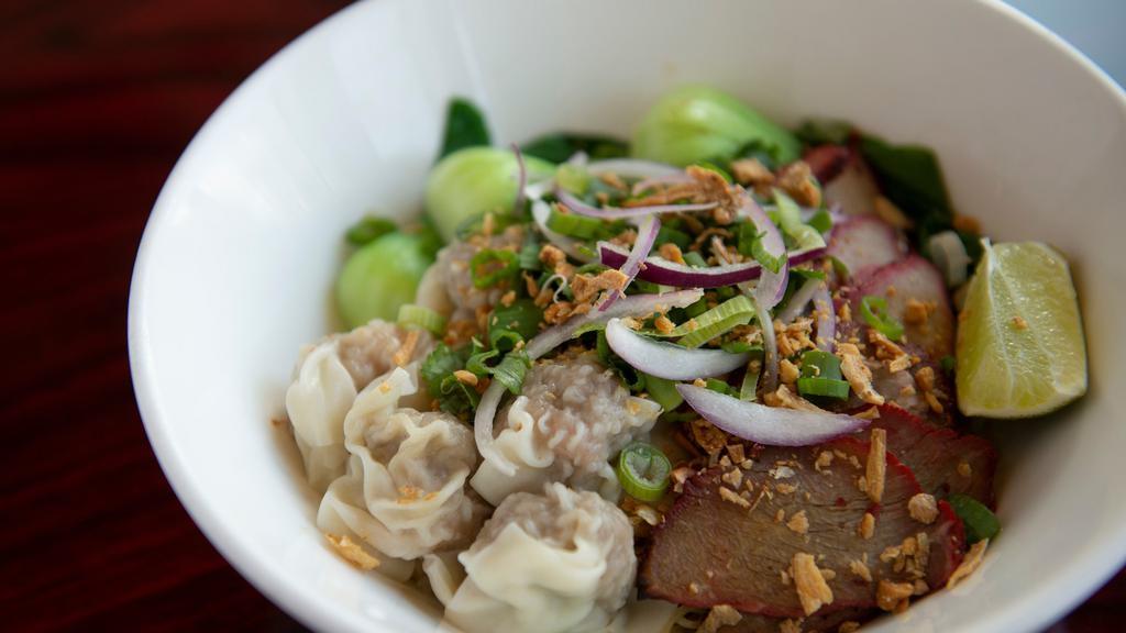 Bah Mee (Served Dry) · Thin egg noodles with pork and shrimp wontons, sliced bbq pork, bean sprouts, bok choy, topped with scallions, fried garlic and chives, mixed with house-made soy sauce and lime.