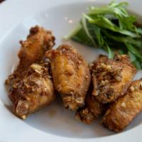 Golden Wings · Deep-fried wings tossed with melted butter and garlic.
