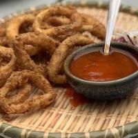 Calamari · Deep-fried calamari lightly dusted served with chili plum sauce.