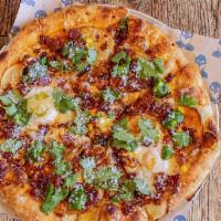 Spicy Chorizo & Egg Pizza · Glazed bacon, crispy potato, corn, avocado salsa verde