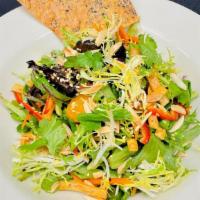 Ginger Sesame · Organic baby greens, julienne vegetables, crisp wontons, mandarin oranges, toasted almonds, ...