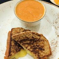 Grilled Cheese And Soup · Organic whole wheat bread, white cheddar cheese, roma tomato basil soup.
