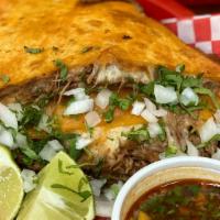 Quesadilla De Birria (Each) · Birria and cheese served inside a flour tortilla. Served with cilantro, onion, lime, and a s...