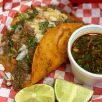 Tacos De Birria (Each) · Birria with the option of cheese in-between a regular sized corn tortilla. Served with onion...