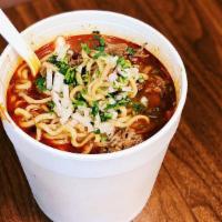 Birria Ramen  · Ramen noodles cooked with consomé. Served with birria, cilantro, onion, and a side of lime. ...
