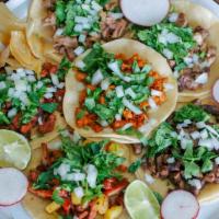 Tacos (Each) · Your choice of meat on two tortillas. Topped with cilantro and onion, served with lime and r...