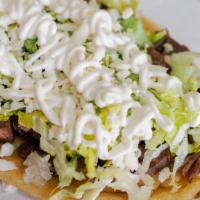 Huarache · One thick fried handmade tortilla served with your choice of meat, beans, lettuce, Mexican c...