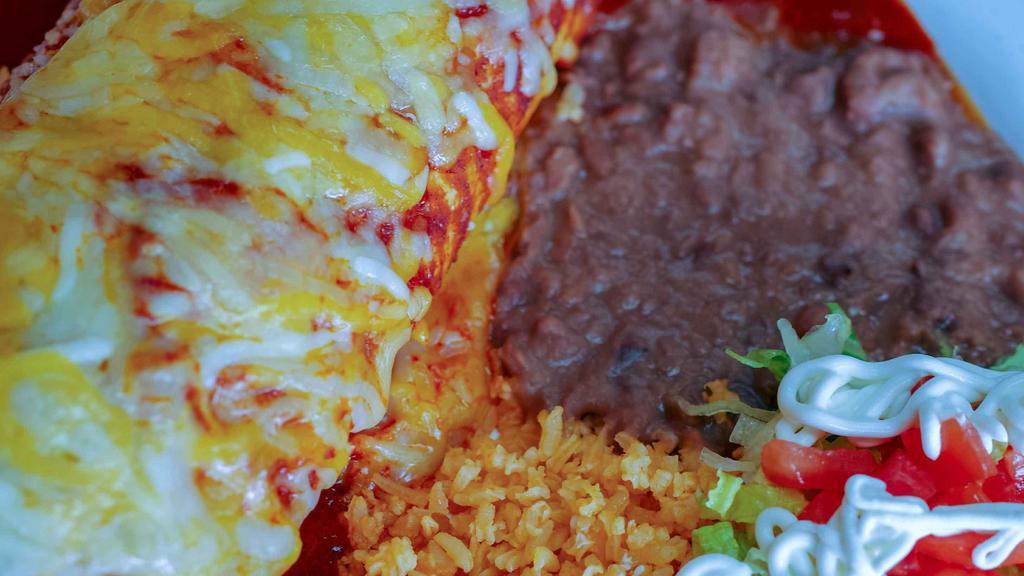 Burrito Plate · Your choice of meat wrapped in a flour tortilla with rice, beans and cheese. Covered in our burrito sauce and served with rice, beans, a side of sour cream.