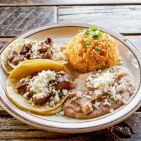 Kids Tacos · Two soft tacos with your choice of protein, served with rice and your choice of beans.