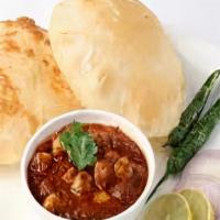 Chole Bature · Deep fried bread served with chickpeas cooked in tomato and onion gravy.