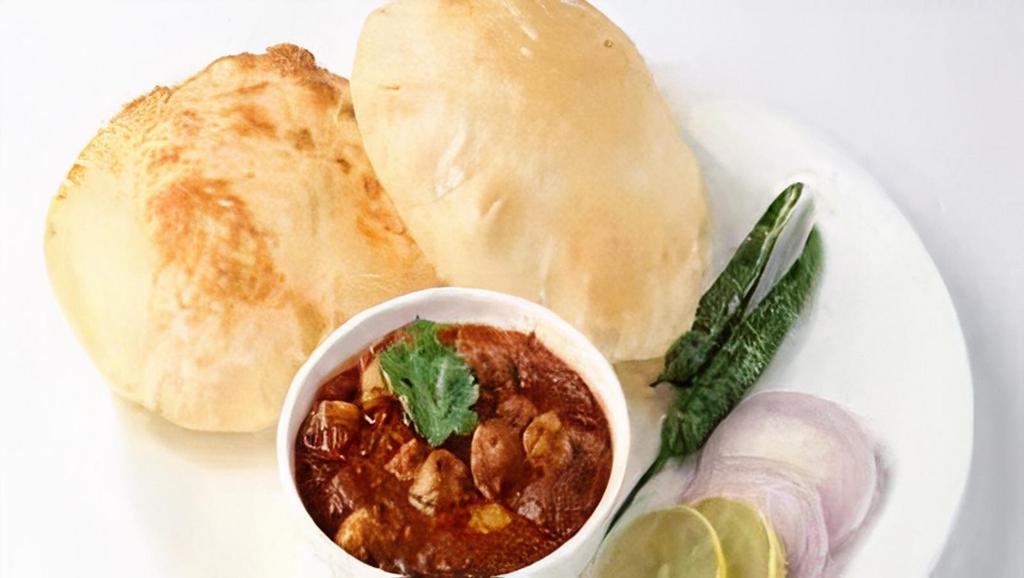 Chole Bature · Deep fried bread served with chickpeas cooked in tomato and onion gravy.
