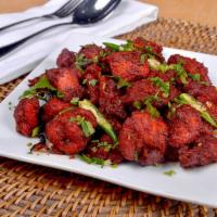 Chicken 65 · Boneless cubes of chicken marinated with Indian spices and deep fried. A popular Indian bar ...