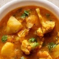 Aloo Gobi Masala · Potatoes and cauliflower cooked with herbs and spices.