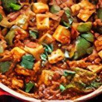 Kadai Paneer · Paneer cooked with onion, bell pepper, tomatoes, and spices.